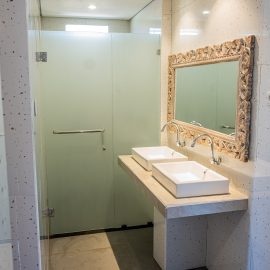 Spacious bathroom with shower and two sinks