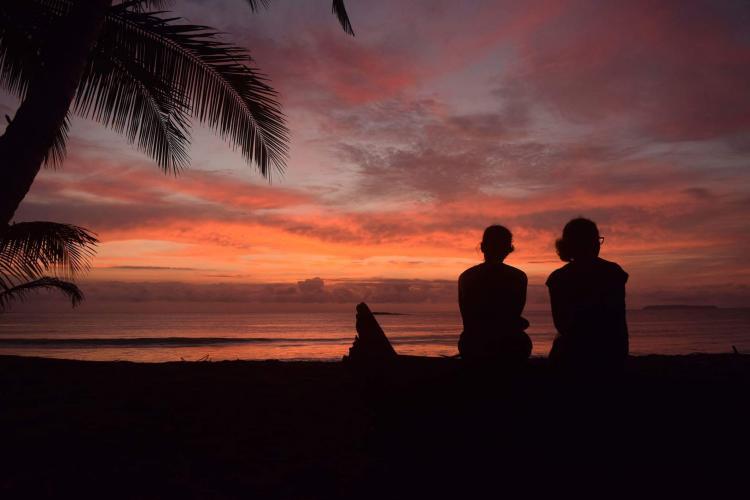 Volunteers enjoying the sunset on the beach