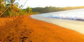 Vies of beach with orange sand in Costa Rica