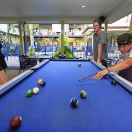 Playing pool at Cairns hostel
