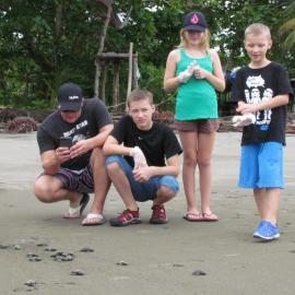 Children with sea turtles in Costa Rica