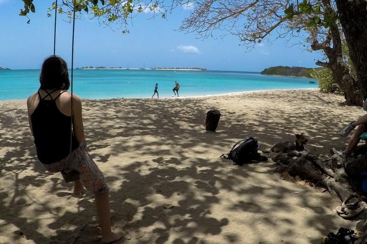 Volunteer chilling on the beach in the Caribbean