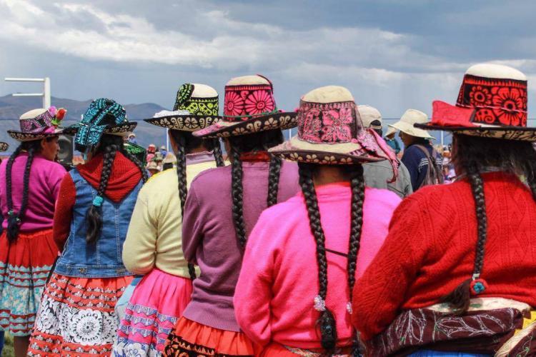 Colourful clothed local indigenous people in Andes Cusco