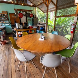 Small round table in kitchen on open platform