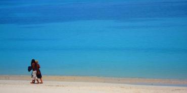 Couple on beach in Grenada