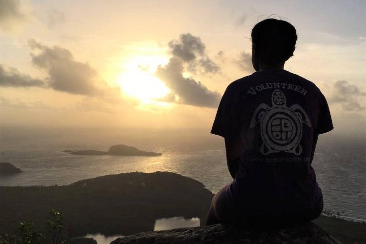 Volunteer at sunset in Grenada