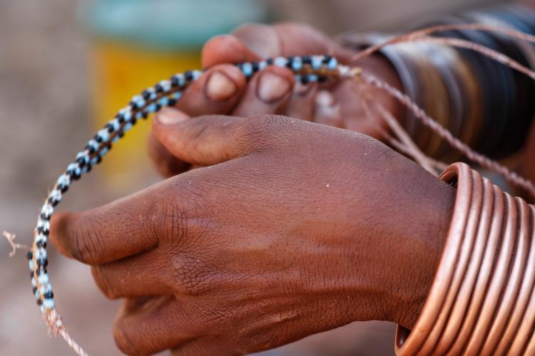 Hands holding strings