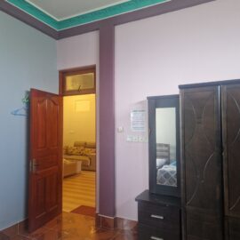 Volunteer bedroom with closet, mirror and drawers