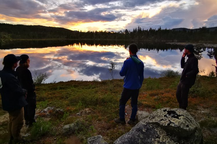 View over lake Sweden, volunteers on expedition