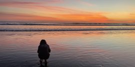 Volunteer admiring Costa Rica sunset at Olive Ridley project