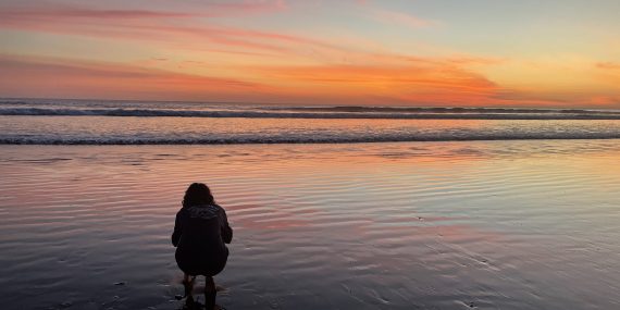 Volunteer admiring Costa Rica sunset at Olive Ridley project