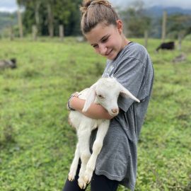 Volunteer with goat Ecuador