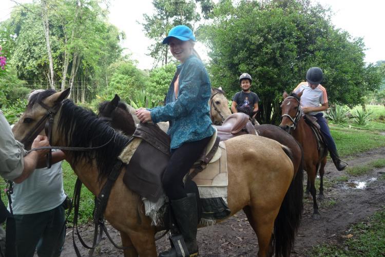 Volunteer on horseback Ecuador cloud forest
