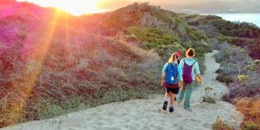 Volunteers walking on beach in South Africa