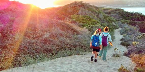 Volunteers walking on beach in South Africa