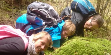 Conservation volunteers with moss New Zealand