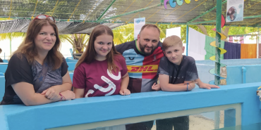 Maldives sea turtle family volunteering